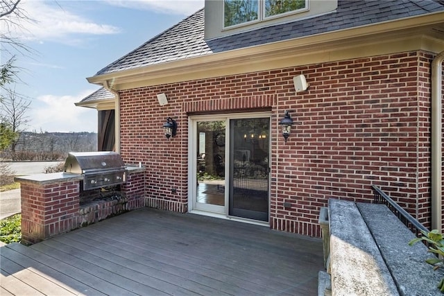 wooden deck featuring area for grilling