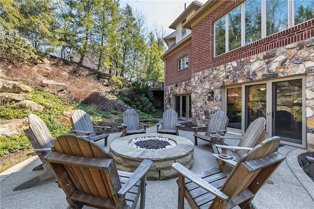 view of patio / terrace with a fire pit