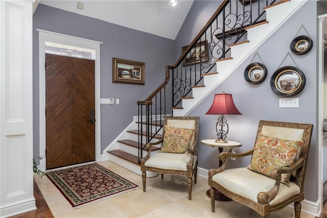 29 Virginia Ln, Cecil, PA 15317 - foyer entrance featuring stairs, lofted ceiling, baseboards, and tile patterned floors