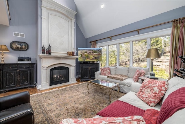 29 Virginia Ln, Cecil, PA 15317 - living area with a glass covered fireplace, lofted ceiling, and wood finished floors