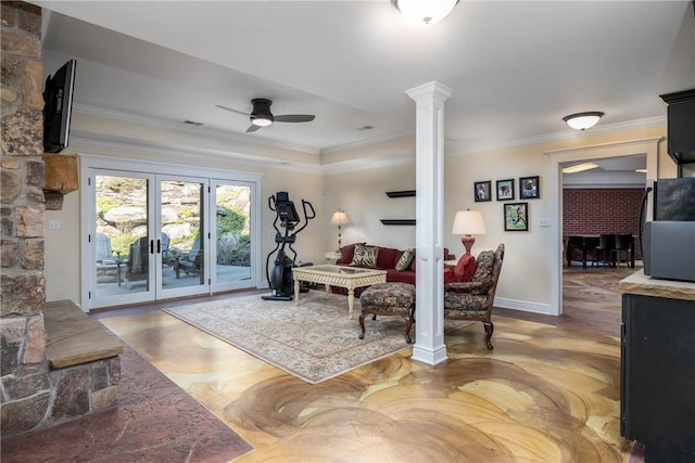 living room featuring ceiling fan, french doors, ornamental molding, and ornate columns