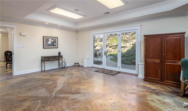 interior space featuring visible vents, a raised ceiling, crown molding, baseboards, and concrete flooring