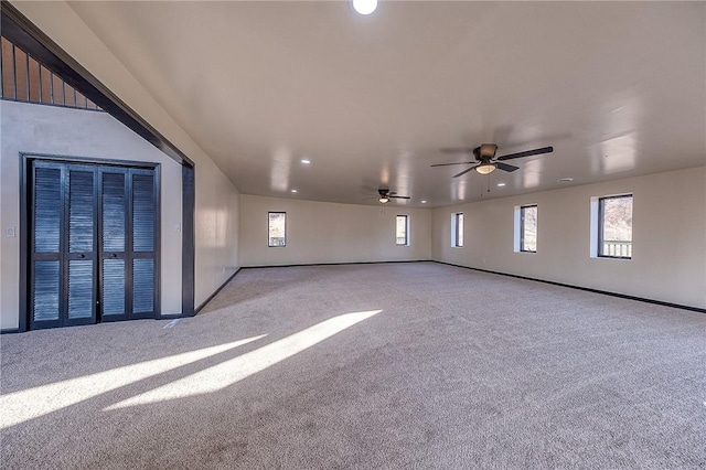 spare room featuring carpet flooring and plenty of natural light