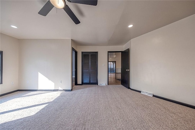 unfurnished room featuring recessed lighting, visible vents, carpet floors, and baseboards