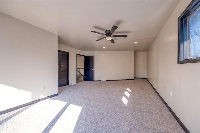 interior space with recessed lighting, ceiling fan, baseboards, and carpet floors