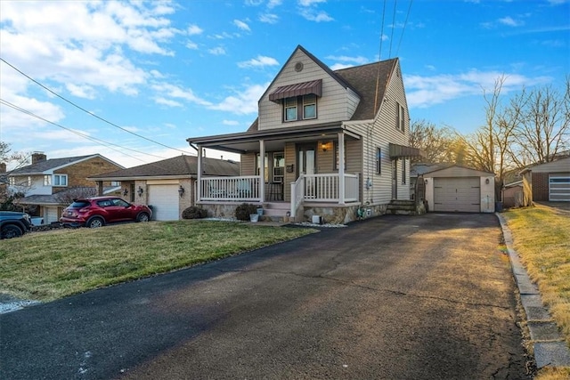 bungalow-style home with driveway, a front lawn, a porch, an outdoor structure, and a garage