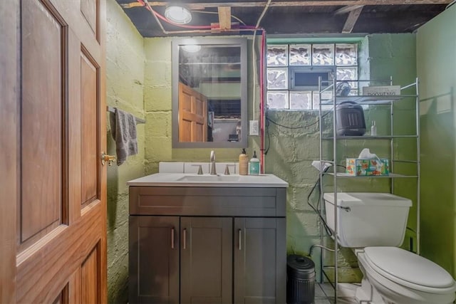 bathroom with toilet and vanity