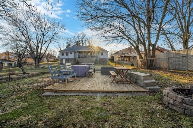 exterior space featuring a fenced backyard, a lawn, and a deck