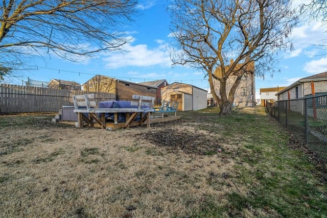 view of yard with a pool and a fenced backyard