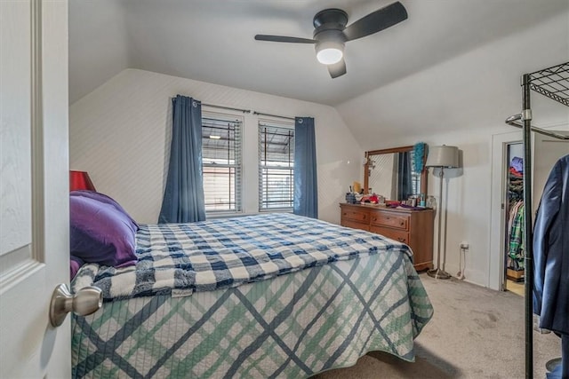 bedroom with carpet, a ceiling fan, and vaulted ceiling