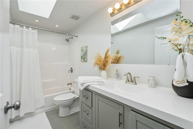 full bath with visible vents, toilet, a skylight, and vanity