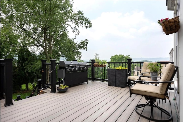 deck featuring a grill