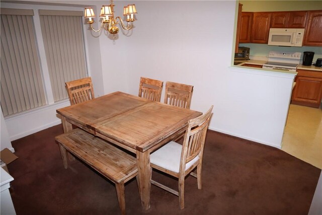 6233 Oyster Bay Ct, South Fayette, PA 15017 - dining room with dark carpet, a chandelier, and baseboards
