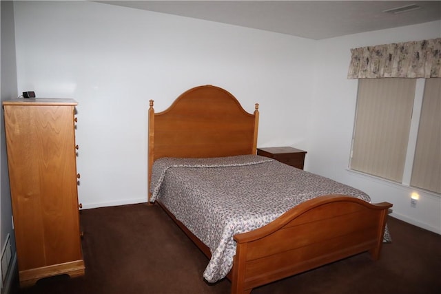 bedroom with baseboards, visible vents, and carpet floors