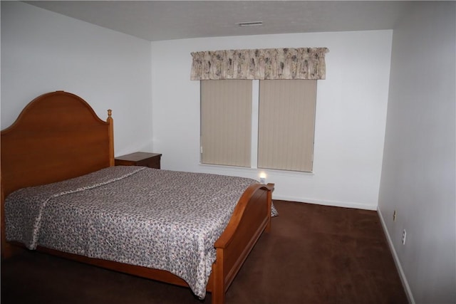 carpeted bedroom with baseboards