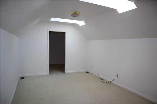 6233 Oyster Bay Ct, South Fayette, PA 15017 - bonus room featuring a skylight, vaulted ceiling, light carpet, and baseboards