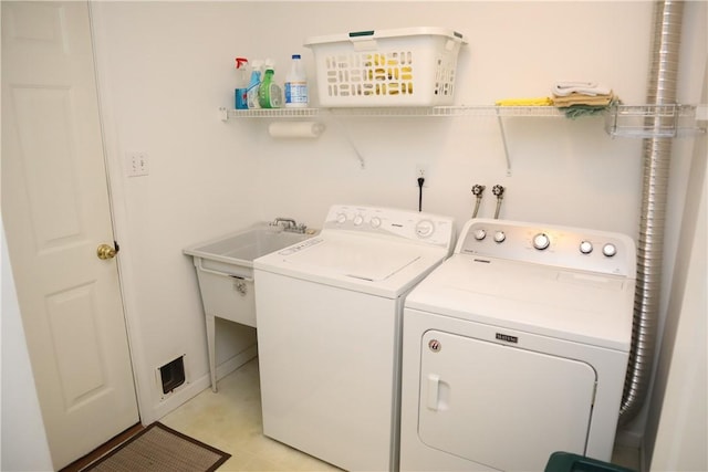 clothes washing area featuring laundry area and washer and dryer