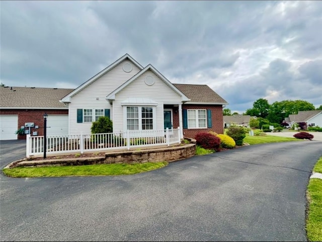 6233 Oyster Bay Ct, South Fayette, PA 15017 - ranch-style house featuring brick siding, driveway, a garage, and covered porch