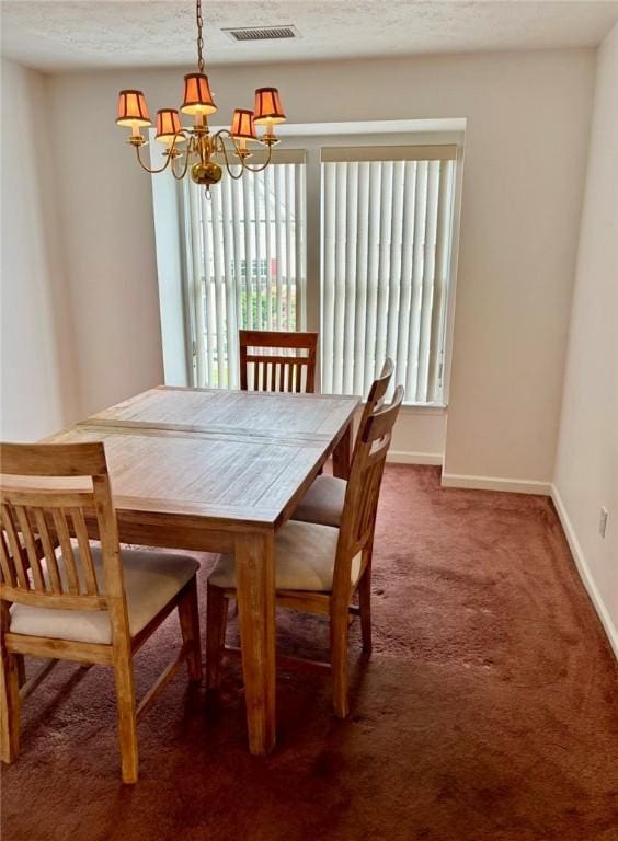 6233 Oyster Bay Ct, South Fayette, PA 15017 - carpeted dining space featuring a chandelier and baseboards
