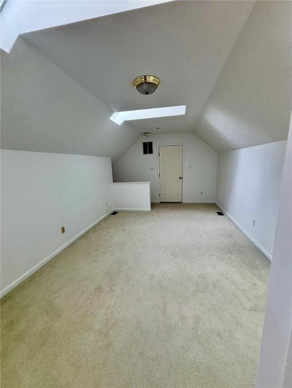 6233 Oyster Bay Ct, South Fayette, PA 15017 - bonus room with baseboards, vaulted ceiling, carpet flooring, and a skylight