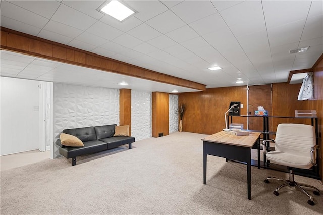 carpeted office space with wooden walls