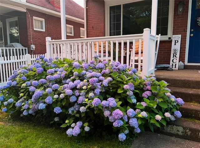 details featuring brick siding and fence