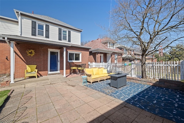 view of patio / terrace with an outdoor living space and fence