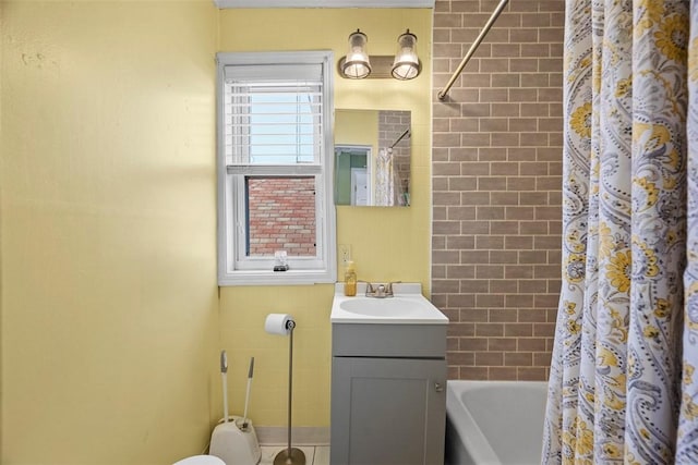 full bath with shower / bath combo with shower curtain and vanity