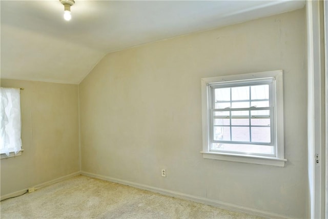 bonus room featuring carpet flooring, baseboards, and vaulted ceiling