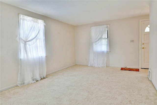 interior space featuring baseboards and carpet