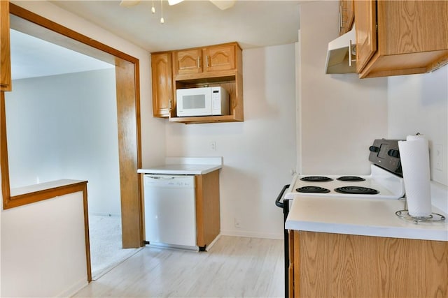 kitchen featuring under cabinet range hood, white appliances, light wood-style floors, light countertops, and ceiling fan