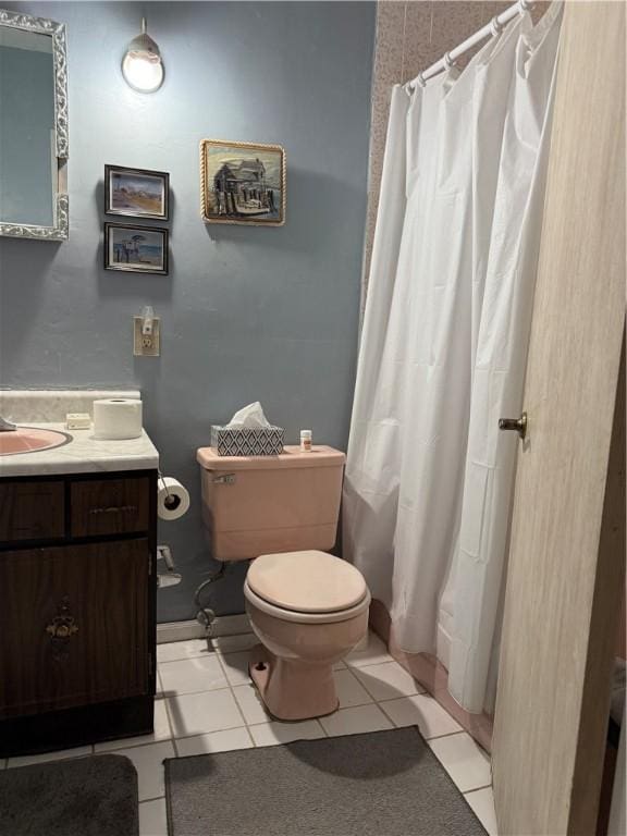 full bathroom with tile patterned floors, curtained shower, toilet, and vanity