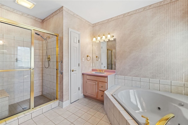 bathroom with vanity, a jetted tub, a shower stall, and tile patterned flooring