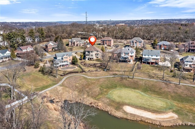 birds eye view of property featuring a residential view and a water view