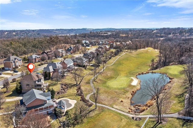 drone / aerial view featuring a residential view and a water view