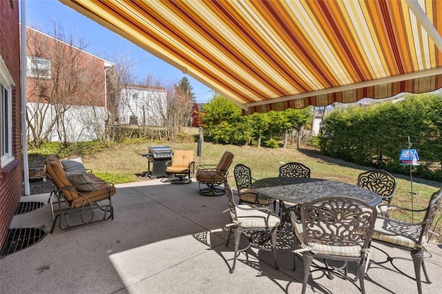 view of patio / terrace with area for grilling and outdoor dining space