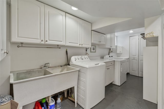 clothes washing area with recessed lighting, a sink, cabinet space, and separate washer and dryer