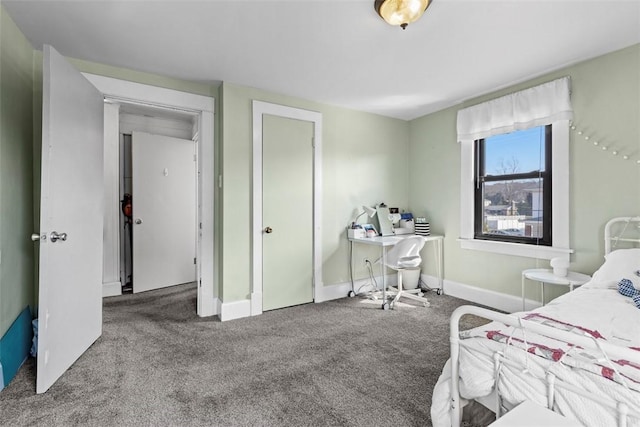 carpeted bedroom with baseboards