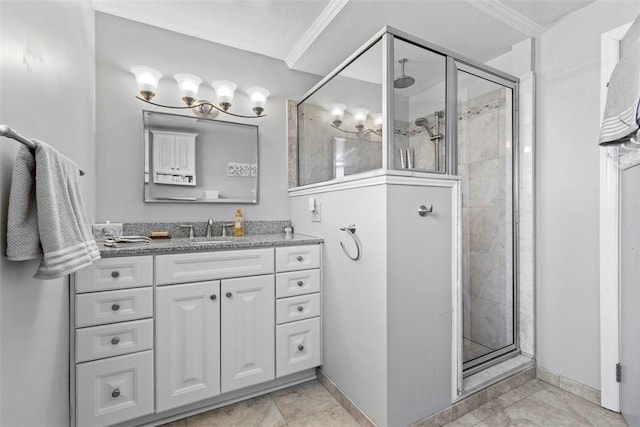 full bath featuring vanity, ornamental molding, and a shower stall