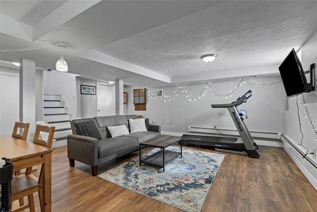 living room featuring stairway, wood finished floors, and baseboards