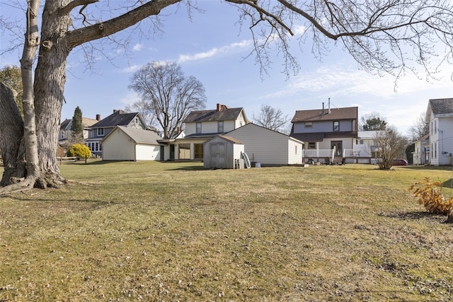 view of yard featuring an outdoor structure and a shed