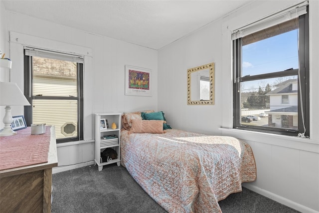 bedroom featuring multiple windows and carpet floors