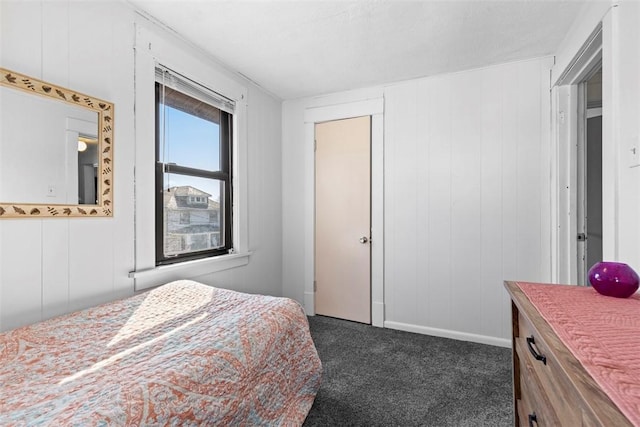 bedroom featuring dark carpet