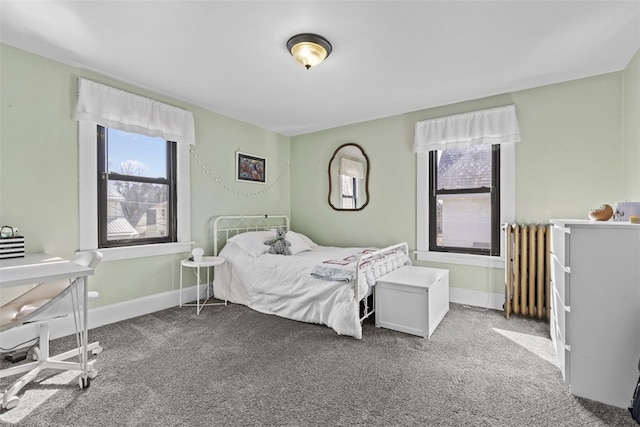 bedroom with baseboards, carpet floors, and radiator heating unit