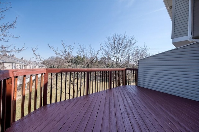 wooden terrace featuring a residential view