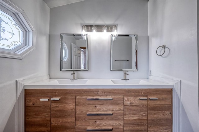 full bath featuring a sink and double vanity