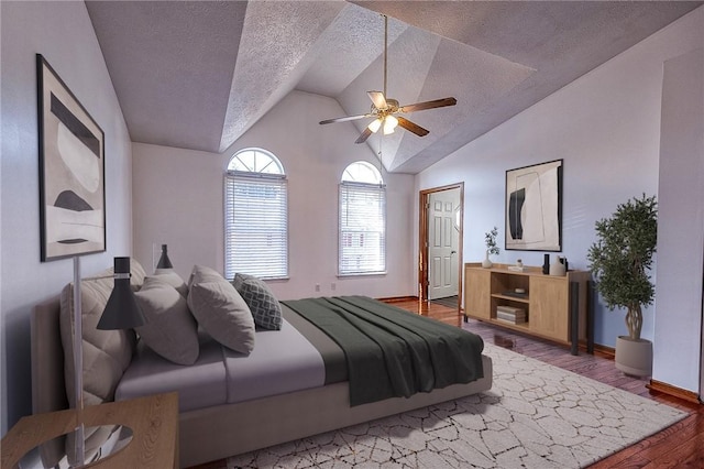 bedroom with lofted ceiling, a ceiling fan, a textured ceiling, wood finished floors, and baseboards