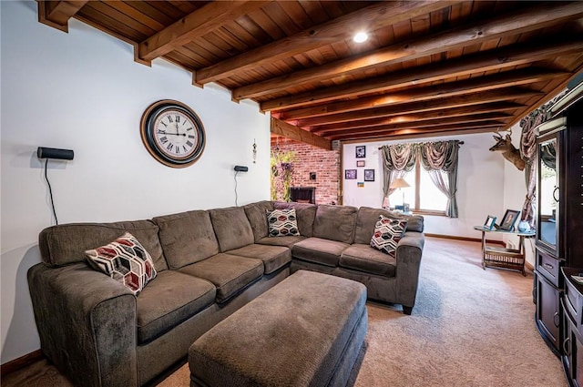 living area with beamed ceiling, wooden ceiling, a fireplace, baseboards, and light colored carpet