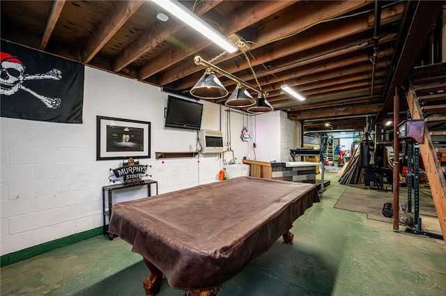 recreation room with concrete flooring, pool table, and water heater