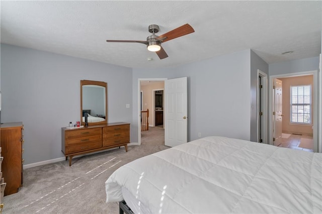 bedroom with carpet flooring, ceiling fan, and baseboards